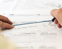 Business professional reviewing TAN documents